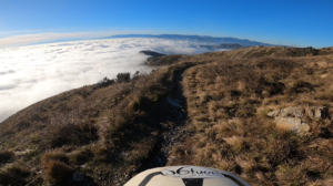 The incredible sea of clouds above the city of Genoa, seen from Monte Fasce during one of our E-MTB Enduro tours